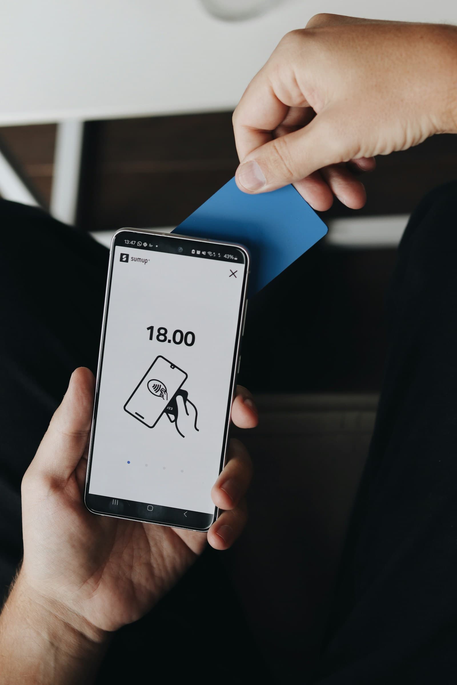 Card tapping an iPhone to pay with Tap to Pay